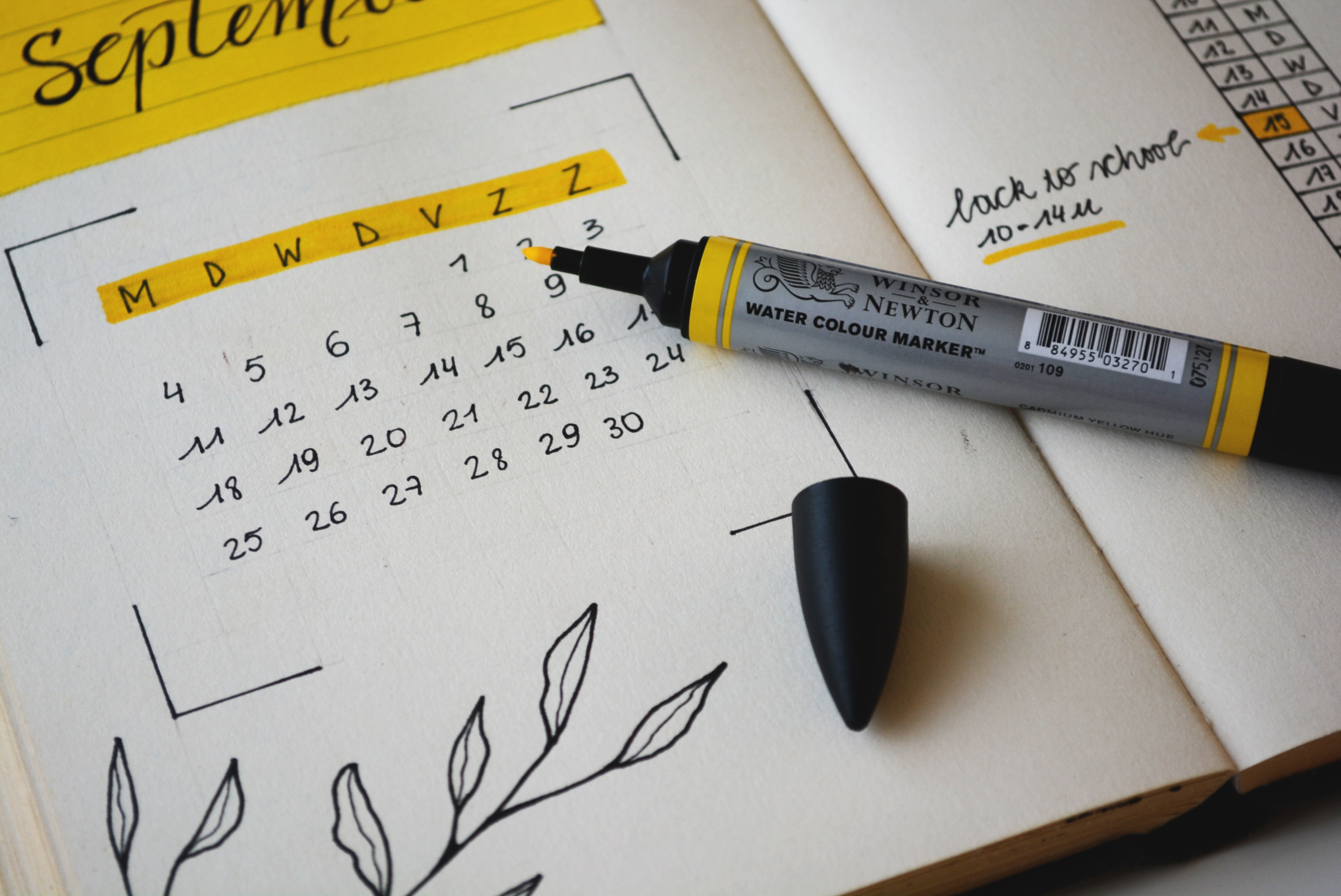 Diary open at September with yellow pen